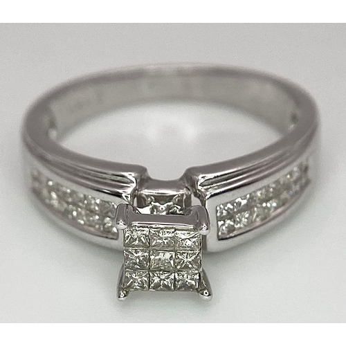 194 - A 14K White Gold Diamond Ring. Nine small central squares with diamond squares on shoulders. 0.50ctw... 