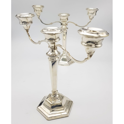 23 - A PAIR OF SILVER CANDELABRA EACH HOLDING 3 CANDLES IN CLASSIC STYLE AND HALLMARKED IN BIRMINGHAM 196... 