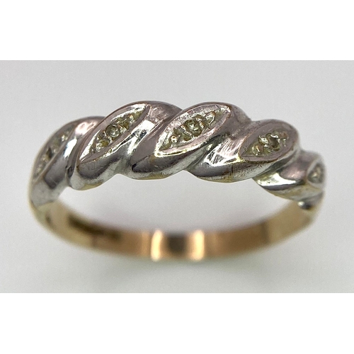 289 - A ( K yellow and white gold twisted ring with diamonds, size:  O, weight: 1.8 g.