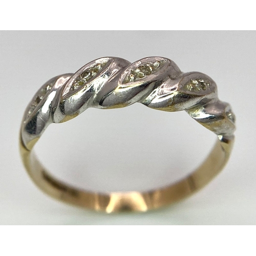 289 - A ( K yellow and white gold twisted ring with diamonds, size:  O, weight: 1.8 g.