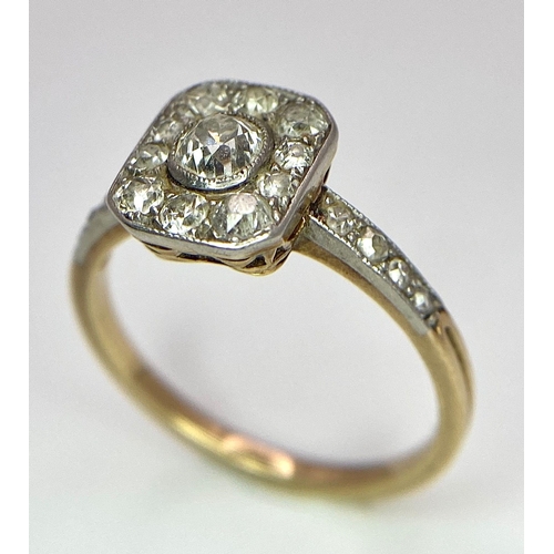 34 - A 9 K yellow gold ring with an ART DECO style diamond cluster and more diamonds on the shoulders, si... 