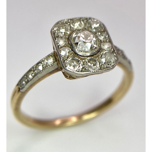 34 - A 9 K yellow gold ring with an ART DECO style diamond cluster and more diamonds on the shoulders, si... 