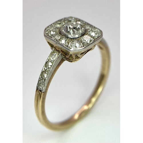 34 - A 9 K yellow gold ring with an ART DECO style diamond cluster and more diamonds on the shoulders, si... 