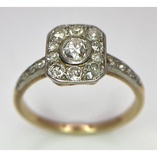 34 - A 9 K yellow gold ring with an ART DECO style diamond cluster and more diamonds on the shoulders, si... 