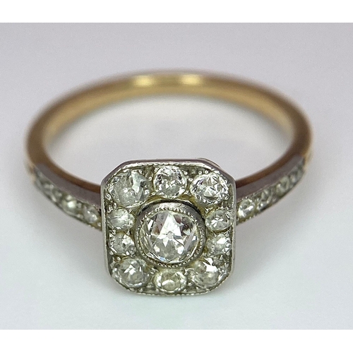 34 - A 9 K yellow gold ring with an ART DECO style diamond cluster and more diamonds on the shoulders, si... 