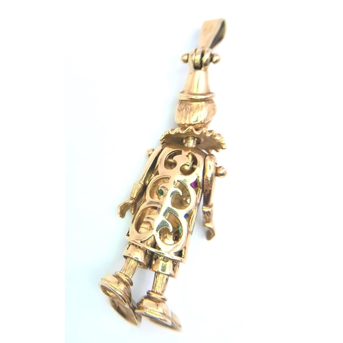 110 - A 9K Yellow Gold Multi-Gemstone Articulated Clown Pendant. 
5.5cm. 9.7g total weight.