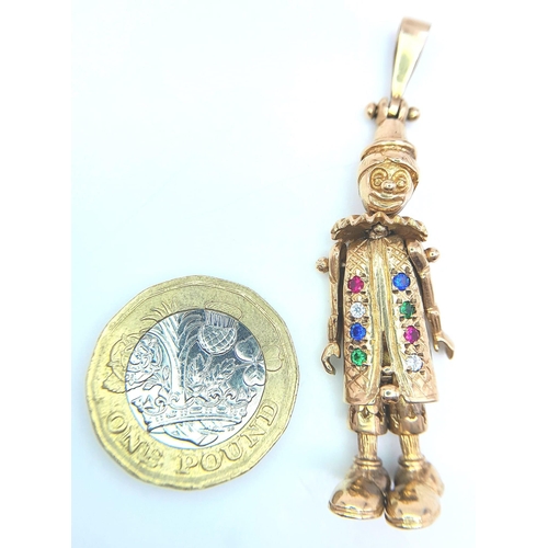 110 - A 9K Yellow Gold Multi-Gemstone Articulated Clown Pendant. 
5.5cm. 9.7g total weight.