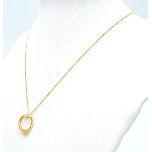 180 - An 18K Yellow Gold Diamond Set Open Heart Pendant on an 18K Yellow Gold Disappearing Necklace. 2cm. ... 