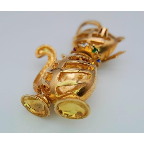 285 - A VERY CUTE 9K YELLOW GOLD ARTICULATED PUSSY CAT CHARM, WITH STONE SET EYES AND COLLAR, WEIGHT 6.1G ... 