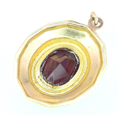 474 - A 9K Yellow Gold (tested) Garnet Pendant. 8 x 10mm garnet. 
2.3g total weight. 2.5cm.