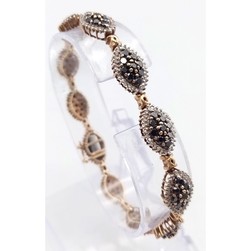 55 - AN ATTRACTIVE 9K YELLOW GOLD BLACK AND WHITE DIAMOND BRACELET WITH SAFETY CATCH, 3.50CT APPROX DIAMO... 