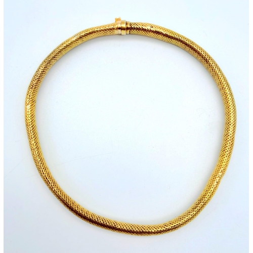 64 - A 9 K yellow gold snake skin bracelet, length: 19 cm, weight: 11.1 g