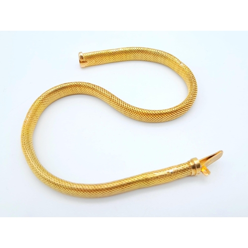 64 - A 9 K yellow gold snake skin bracelet, length: 19 cm, weight: 11.1 g