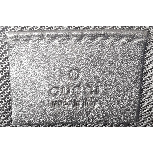 706 - A Gucci Black Monogram Pochette Boat Bag. Textile exterior with black and silver-toned hardware, sin... 