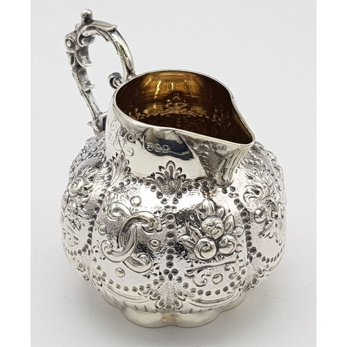 108 - A SMALL SOLID SILVER JUG WITH THE INSCRIPTION 