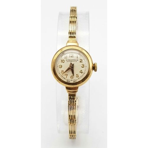 184 - A very elegant, vintage, 9 K yellow gold WINEGARTENS, LONDON E.C. 2  ladies watch. Champagne coloure... 