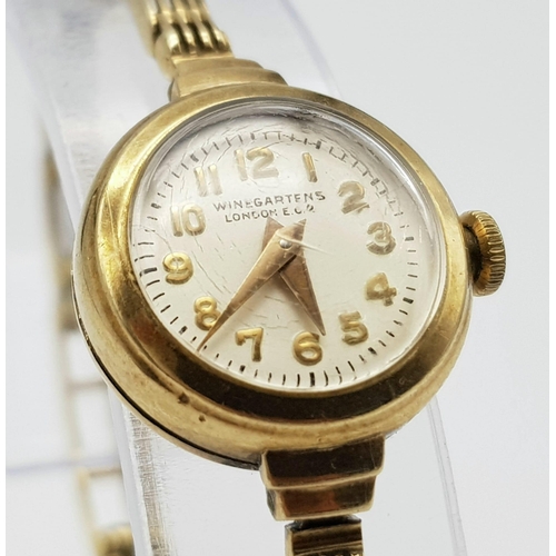 184 - A very elegant, vintage, 9 K yellow gold WINEGARTENS, LONDON E.C. 2  ladies watch. Champagne coloure... 