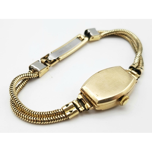 190 - A  vintage, 9 K yellow gold ISIS watch with a double snake chain bracelet. Case 19 x 15 mm, champagn... 