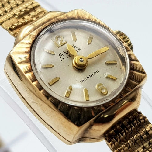 247 - A vintage, 9 K yellow gold AVIA INCABLOC ladies watch. 14  mm case, champagne coloured dial with gol... 