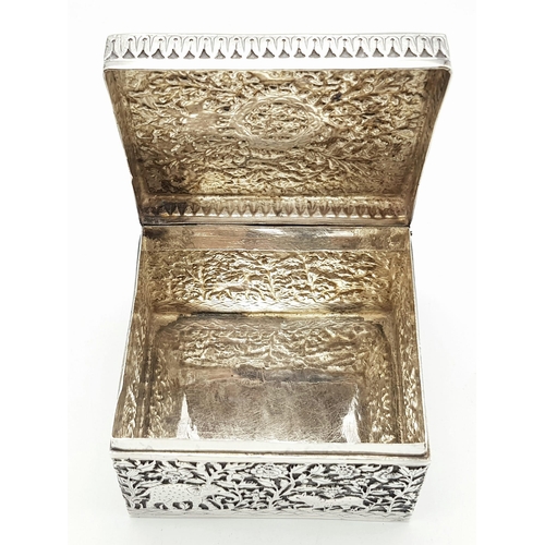 30 - A SOLID SILVER HINGED TRINKET BOX HAND ENGRAVED WITH AN AFRICAN THEME, IN VERY GOOD CONDITION AND AL... 