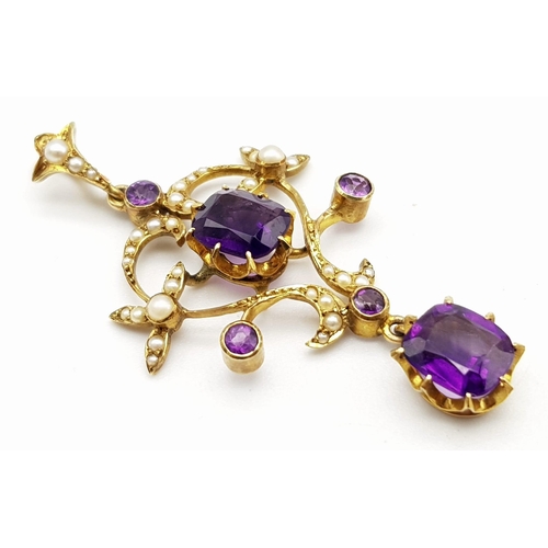 41 - An ART NOUVEAU 9 K yellow gold pendant with vivid coloured amethysts and natural seed pearls, accomp... 