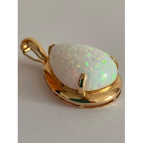 420 - 14 carat GOLD and OPAL PENDANT. Having a large pear-shaped WHITE FIRE OPAL Set in 14 carat gold moun... 