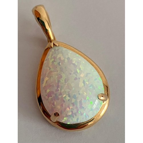 420 - 14 carat GOLD and OPAL PENDANT. Having a large pear-shaped WHITE FIRE OPAL Set in 14 carat gold moun... 