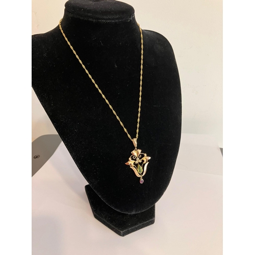 455 - Antique 9 carat GOLD PENDANT set with PERIDOT,GARNET, and SEED PEARL detail, mounted on a 9 carat GO... 