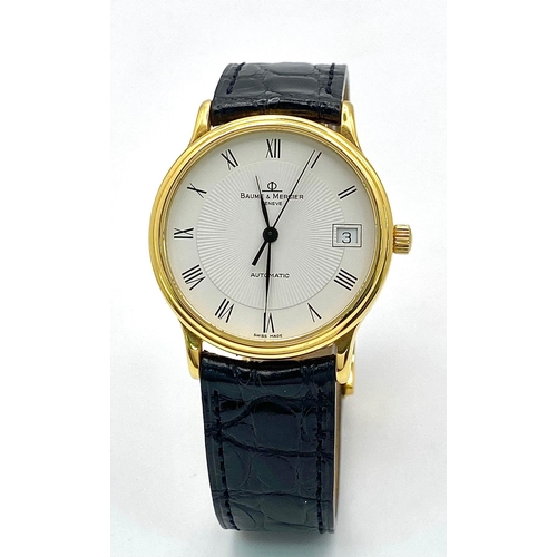 39 - A Baume and Mercier 18K Gold Cased Automatic Gents Watch. Model - MV045075. Black leather strap. 18k... 