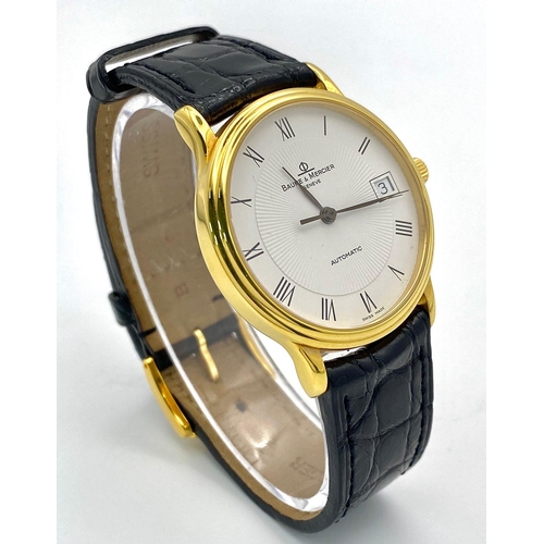 39 - A Baume and Mercier 18K Gold Cased Automatic Gents Watch. Model - MV045075. Black leather strap. 18k... 