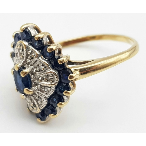 404 - A 9K Yellow Gold Diamond and Sapphire Cluster Ring. Size O. 3.3g total weight.