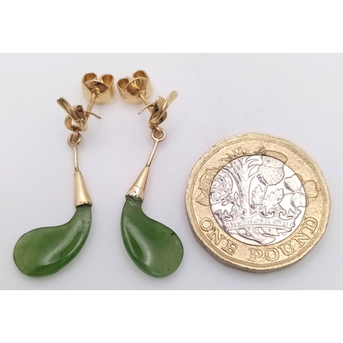 467 - A Pair of 14K Yellow Gold and Jade Earrings. 2.4g total weight.