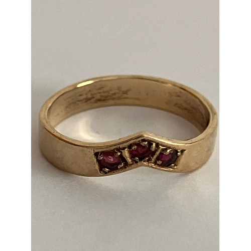 567 - 9 carat GOLD and RUBY RING. Having three round cut RUBIES set in a GOLD CHEVRON RING. Full UK hallma... 