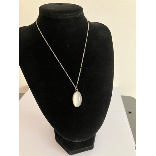 623 - SILVER and MOONSTONE PENDANT Mounted on a Silver Chain. Pendant 3 cm. Silver Chain 38 cm.