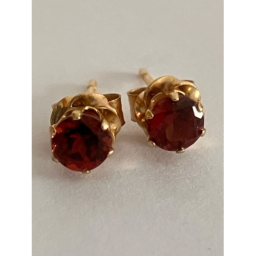 651 - 2 x Pairs 9 carat GOLD STUD EARRINGS. To include Zirconia, and Garnet complete with gold backs. 0.72... 