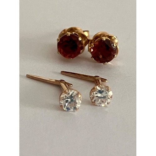 651 - 2 x Pairs 9 carat GOLD STUD EARRINGS. To include Zirconia, and Garnet complete with gold backs. 0.72... 