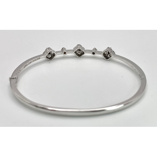 68 - A VERY PRETTY AND ATTRACTIVE 18K WHITE GOLD DIAMOND SET BANGLE, APPROX 0.30CT, WEIGHT 8.5G AND 53MM ... 