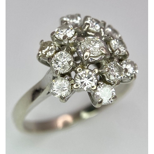 89 - An 18 K white gold ring with a cluster of diamonds (1.10 carats), size: K, weight: 3.6 g.