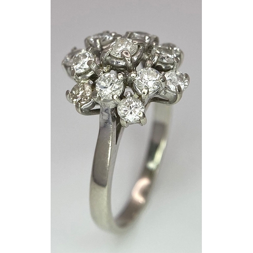 89 - An 18 K white gold ring with a cluster of diamonds (1.10 carats), size: K, weight: 3.6 g.