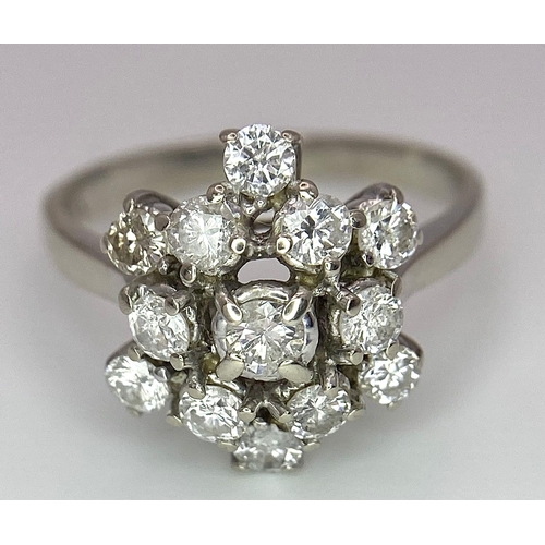 89 - An 18 K white gold ring with a cluster of diamonds (1.10 carats), size: K, weight: 3.6 g.