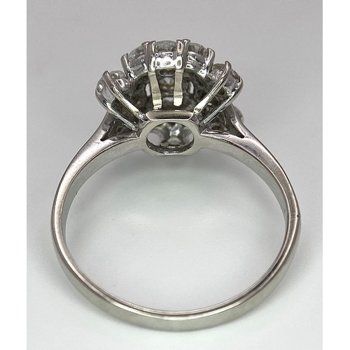 89 - An 18 K white gold ring with a cluster of diamonds (1.10 carats), size: K, weight: 3.6 g.