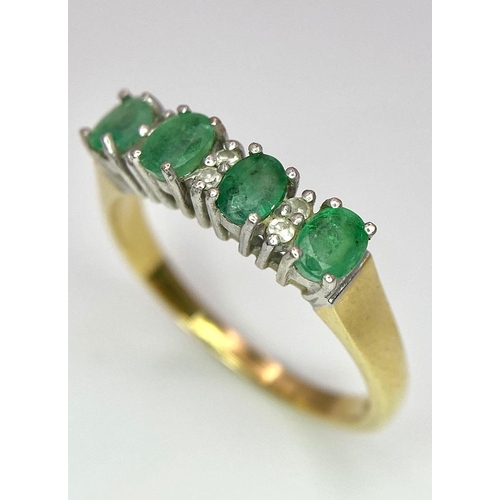 157 - An 18 K yellow gold ring with a band of alternating diamonds and emeralds, size: R, weight: 3.9 g.