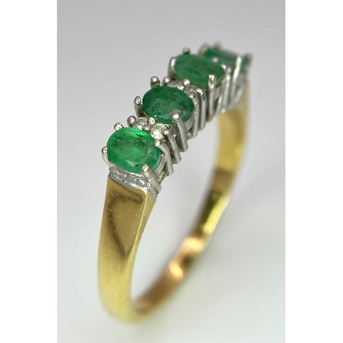 157 - An 18 K yellow gold ring with a band of alternating diamonds and emeralds, size: R, weight: 3.9 g.