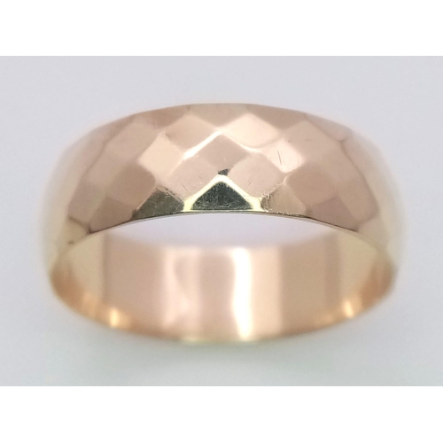 236 - A 9K Yellow Gold Faceted Wedding Band. Size N 1/2. 2.7g total weight.