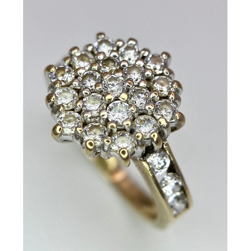 243 - A 9K Yellow Gold CZ Flower Cluster Ring. Size I. 3.1g total weight.