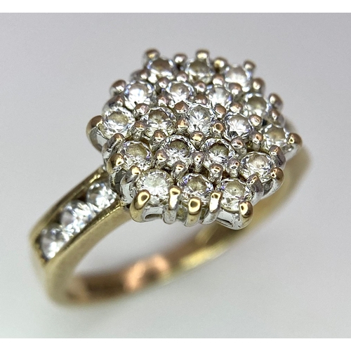 243 - A 9K Yellow Gold CZ Flower Cluster Ring. Size I. 3.1g total weight.