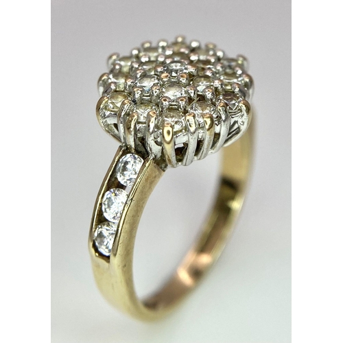 243 - A 9K Yellow Gold CZ Flower Cluster Ring. Size I. 3.1g total weight.