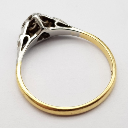 306 - A Vintage 18K Yellow Gold and Platinum Diamond Ring. Round cut diamond in a heart setting. Size O. 2... 