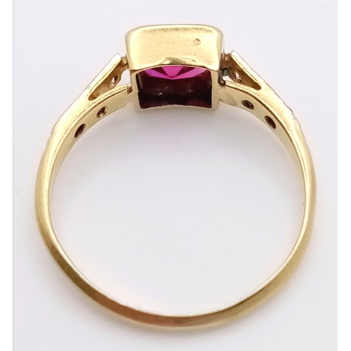 351 - A vintage 18 K yellow gold and platinum ring with a ruby on top and diamonds on the shoulders of the... 