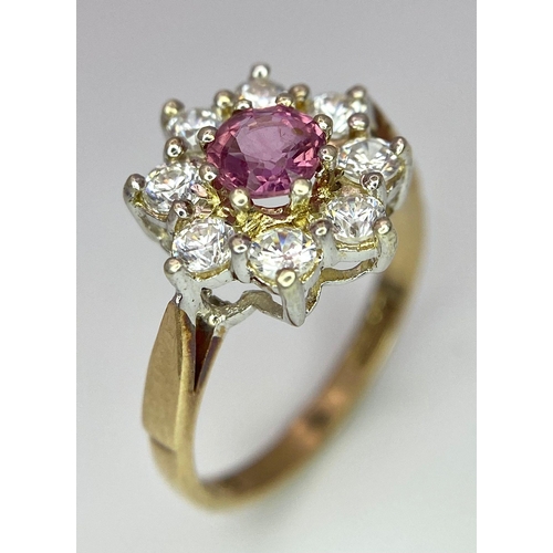 369 - AN ATTRACTIVE 9K YELLOW GOLD STONE SET CLUSTER RING IN FLORAL DESIGN, WEIGHT 1.9G SIZE J